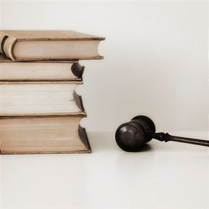 Stack of law books with a gavel 