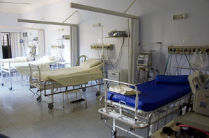 multiple hospital beds in a hospital 