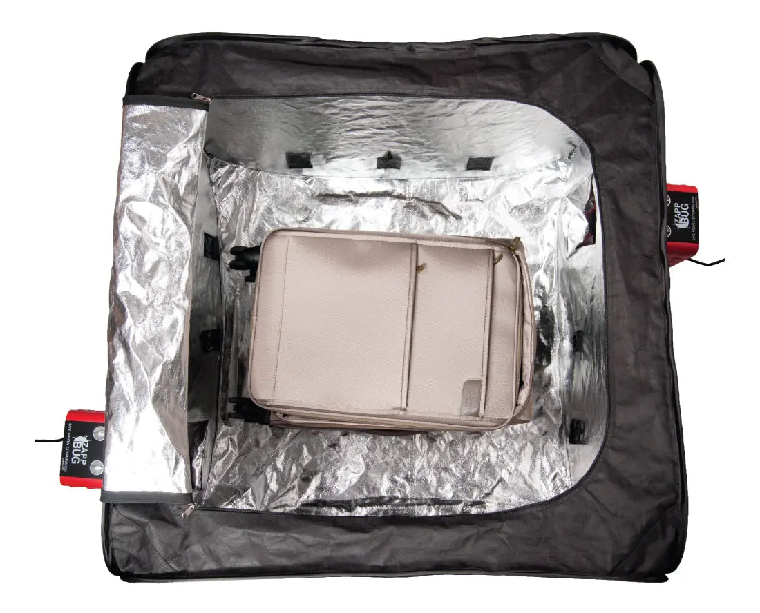ZappBug Oven 2 loaded with a medium size luggage